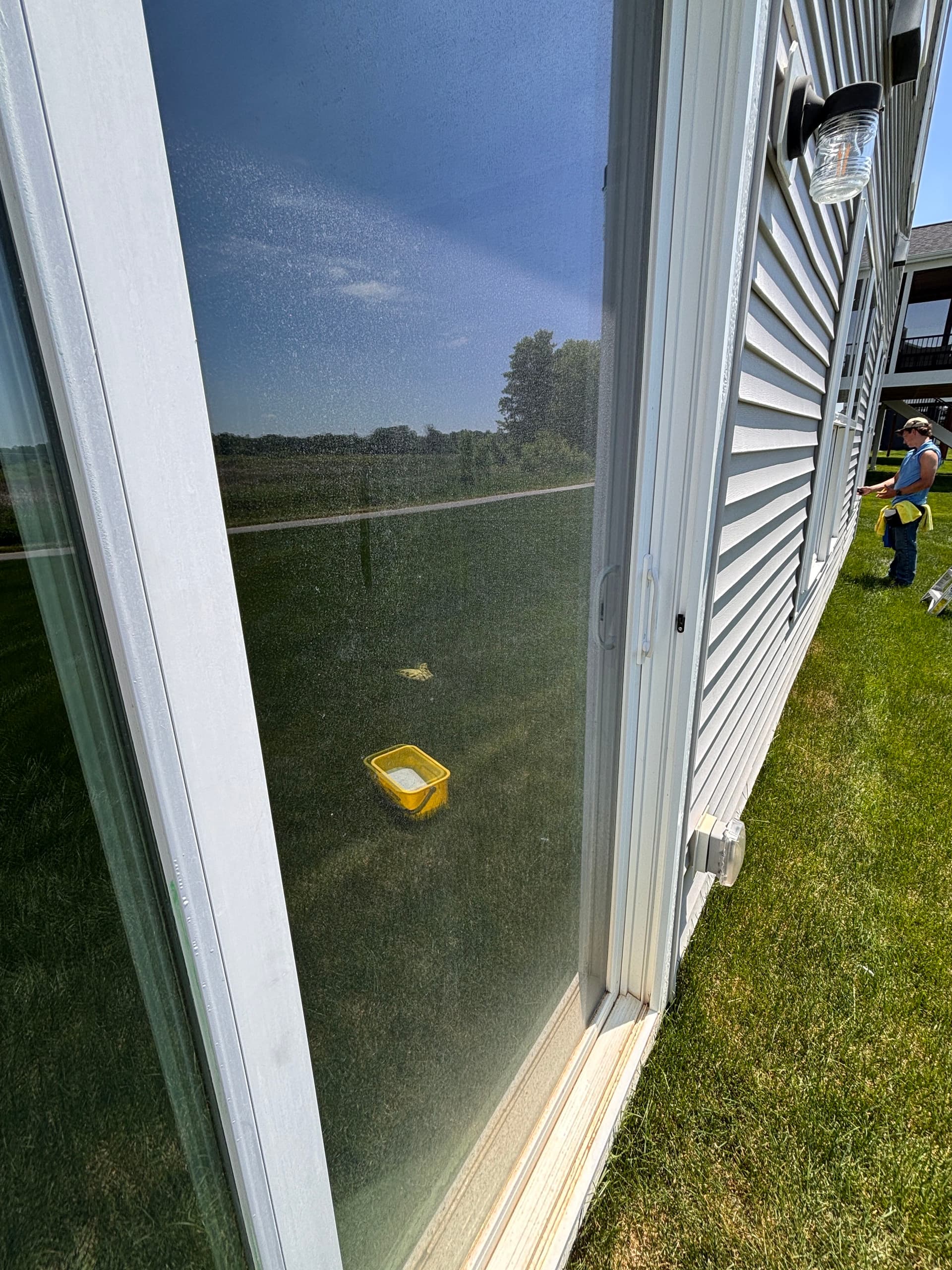 Hard Water Stain Removal on a Sliding Door in Rogers image